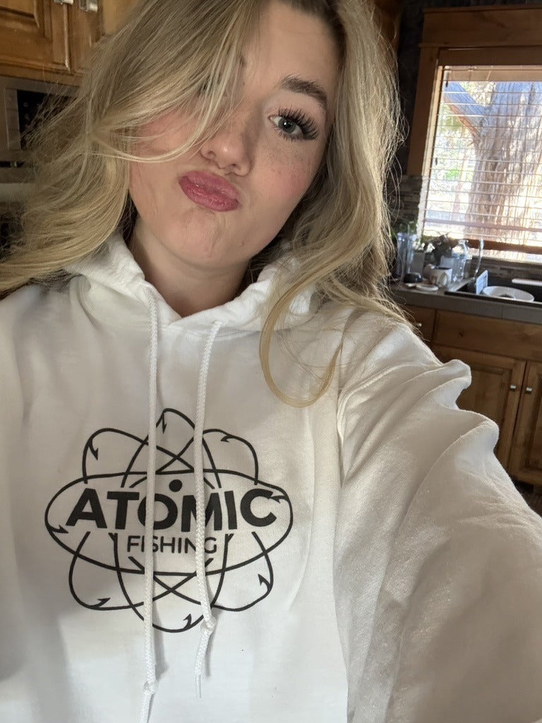 Sequoia wearing the white Atomic Fishing logo hoodie